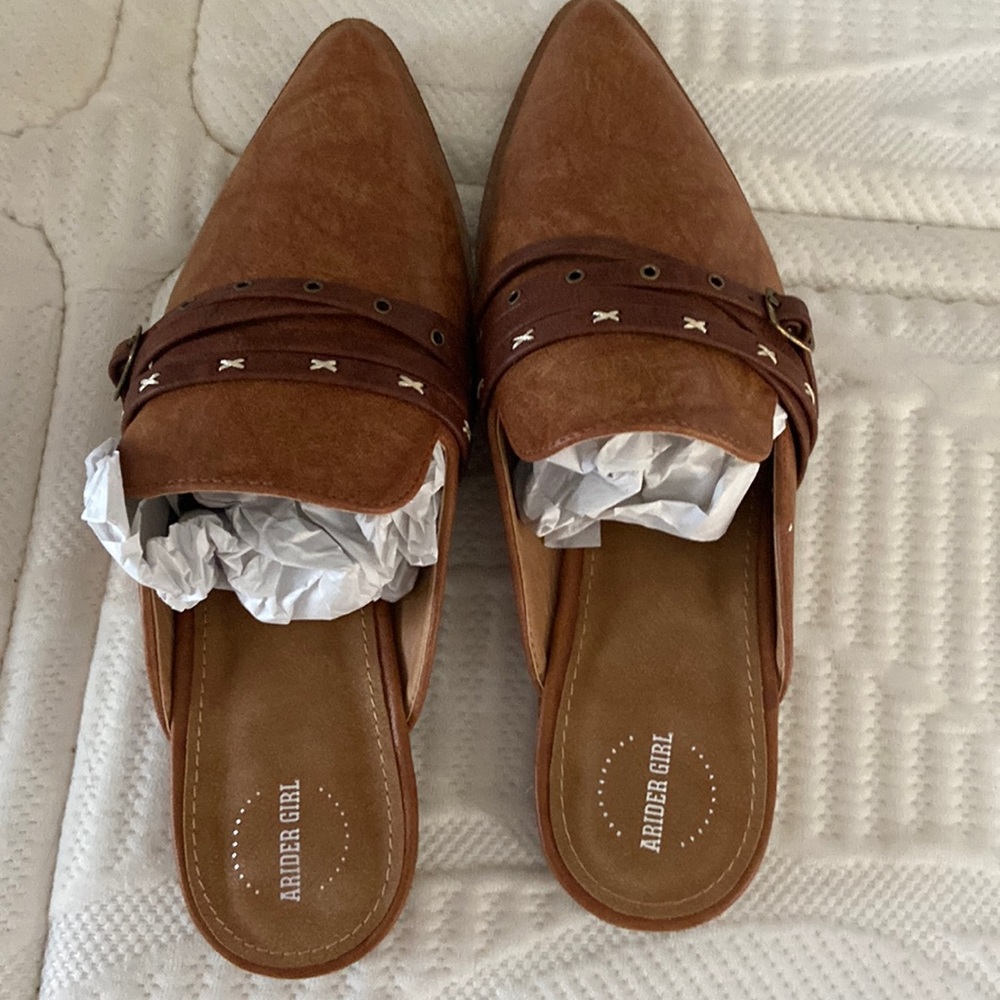 A Rider Girl slip on shoes.  Brand new still in box.  Whiskey color.